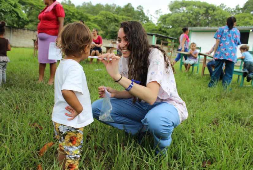 student tending to child